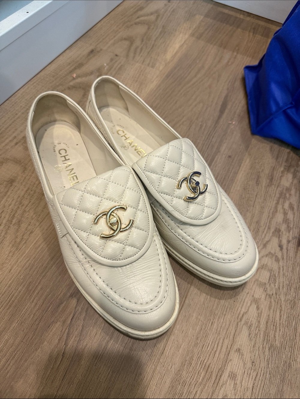 AUTHENTICChanel Ivory Leather Loafers with Gold CC Logo